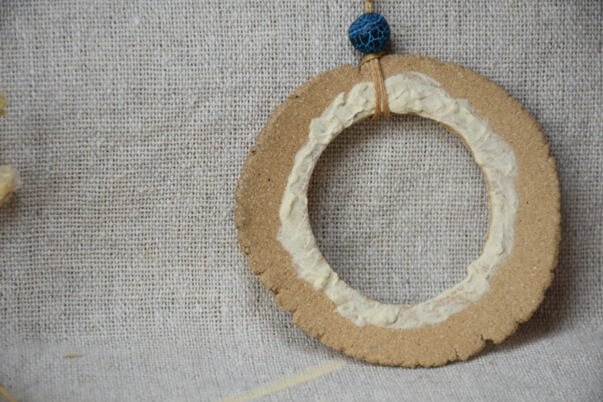 Handmade Ceramic Donut Necklace | Earthy Clay Circle Pendant with Blue Bead Handmade Ceramic Donut Necklace | Earthy Clay Circle Pendant with Blue Bead