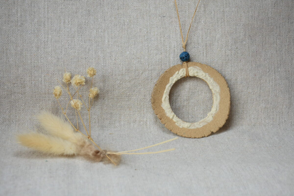 Handmade Ceramic Donut Necklace | Earthy Clay Circle Pendant with Blue Bead Handmade Ceramic Donut Necklace | Earthy Clay Circle Pendant with Blue Bead