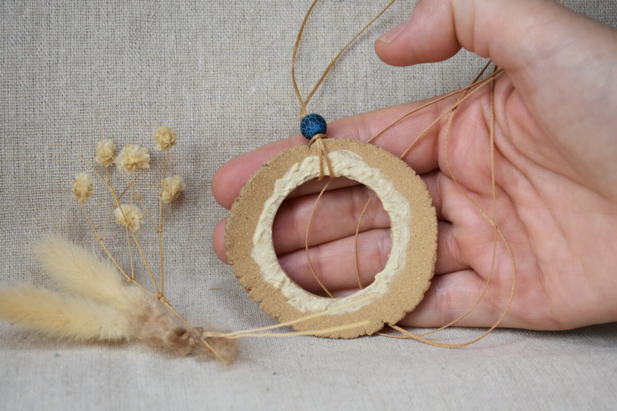 Handmade Ceramic Donut Necklace | Earthy Clay Circle Pendant with Blue Bead Handmade Ceramic Donut Necklace | Earthy Clay Circle Pendant with Blue Bead