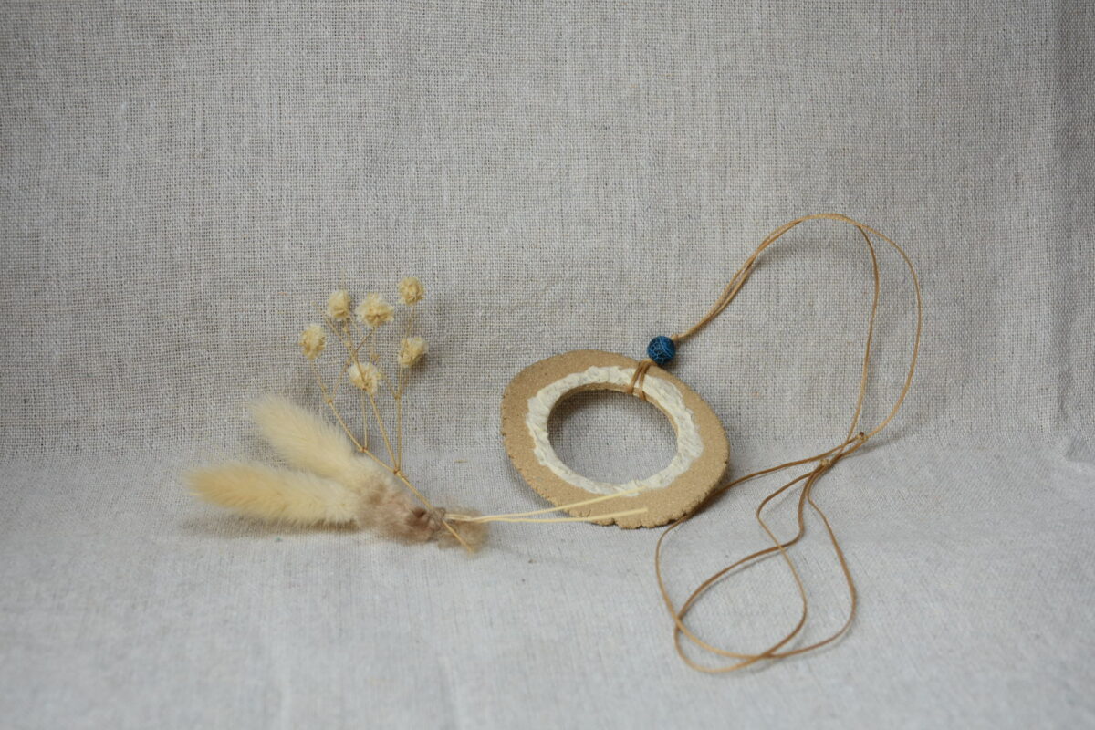 Handmade Ceramic Donut Necklace | Earthy Clay Circle Pendant with Blue Bead Handmade Ceramic Donut Necklace | Earthy Clay Circle Pendant with Blue Bead