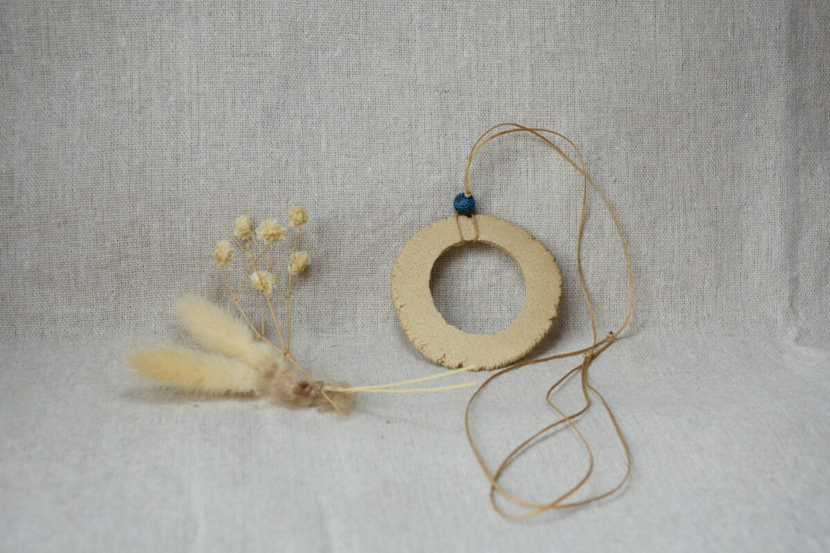 Handmade Ceramic Donut Necklace | Earthy Clay Circle Pendant with Blue Bead Handmade Ceramic Donut Necklace | Earthy Clay Circle Pendant with Blue Bead
