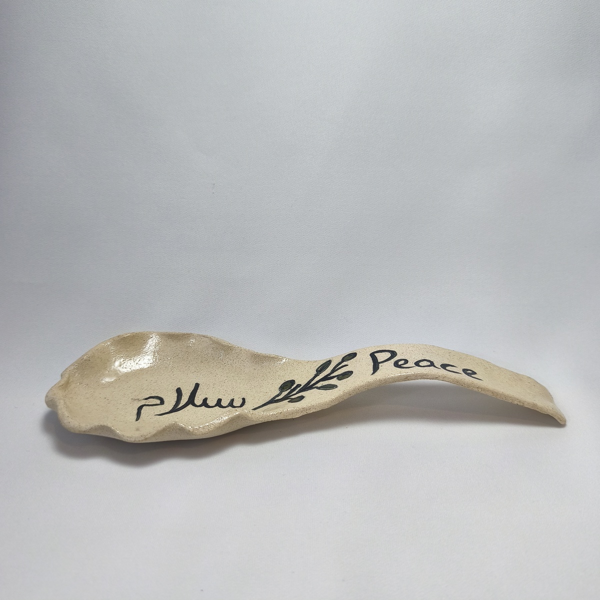 Handmade Ceramic Spoon Rest | Peace & Salam Olive Branch Pottery Handmade Ceramic Spoon Rest | Peace & Salam Olive Branch Pottery