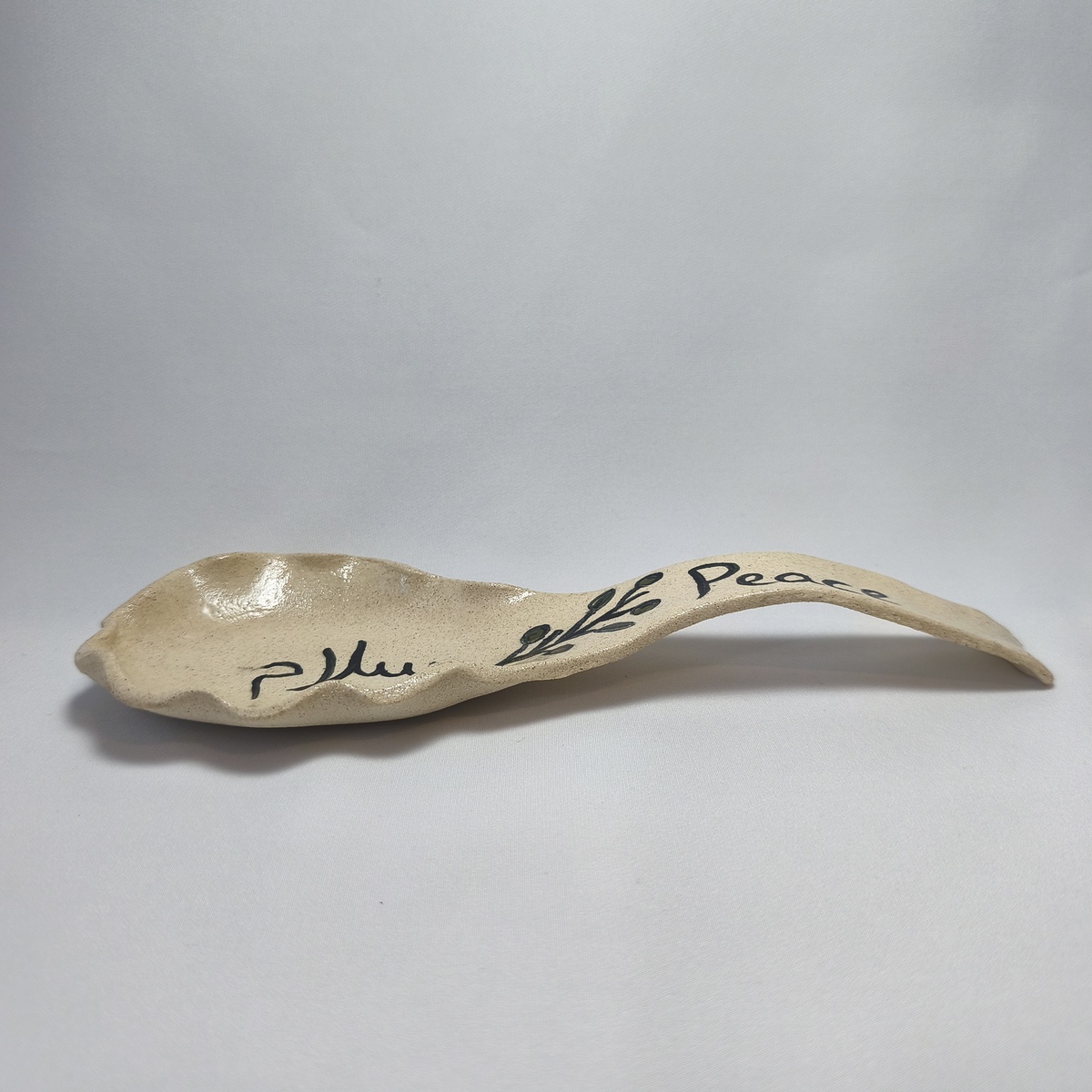 Handmade Ceramic Spoon Rest | Peace & Salam Olive Branch Pottery Handmade Ceramic Spoon Rest | Peace & Salam Olive Branch Pottery